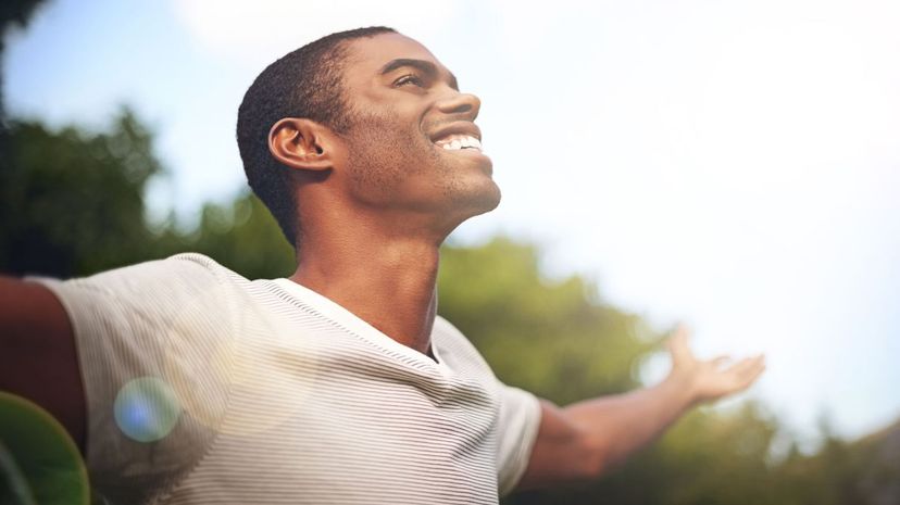 Happy man opens arm