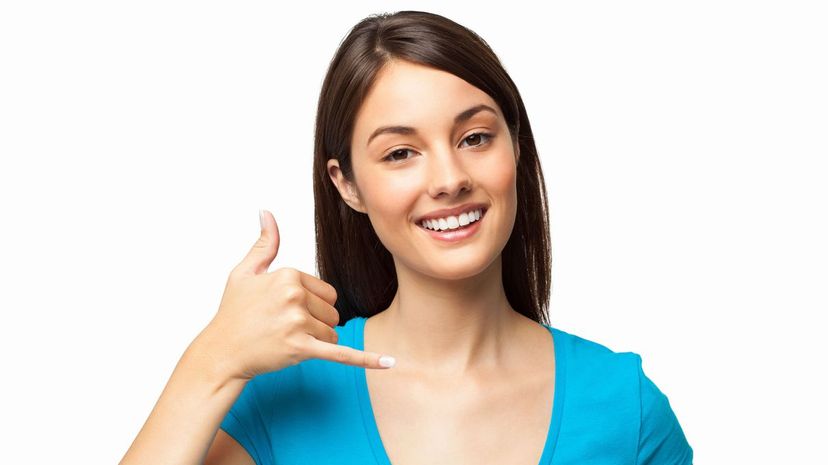 Woman with call me hand gesture