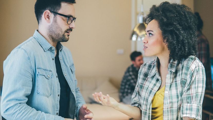 Two people talking at party