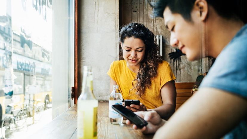 Two Friends Using Smartphone