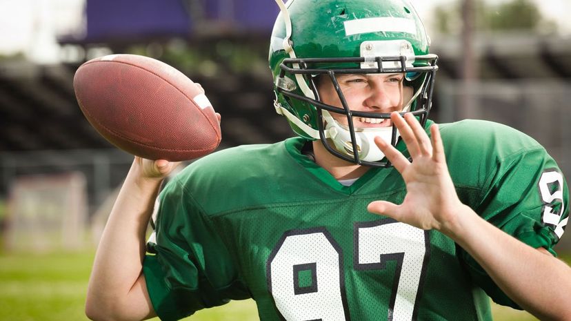 American Football Player Quarterback Throwing a Pass