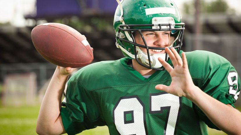 American Football Player Quarterback Throwing a Pass