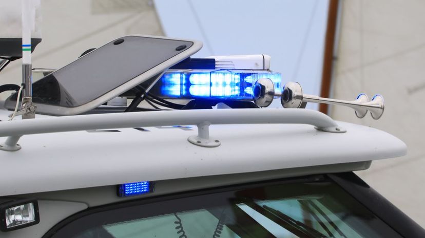 Police strobe lights illuminated on a patrol boat