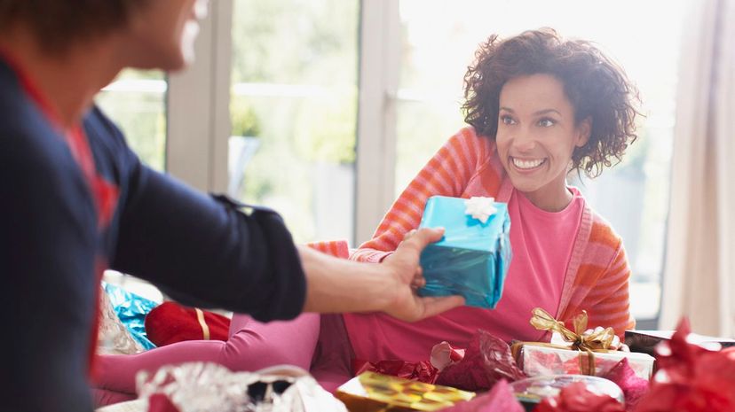 Man giving Woman Christmas Gift