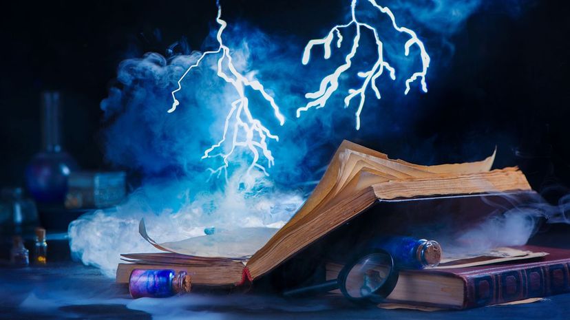 An open book with tiny lightning above it