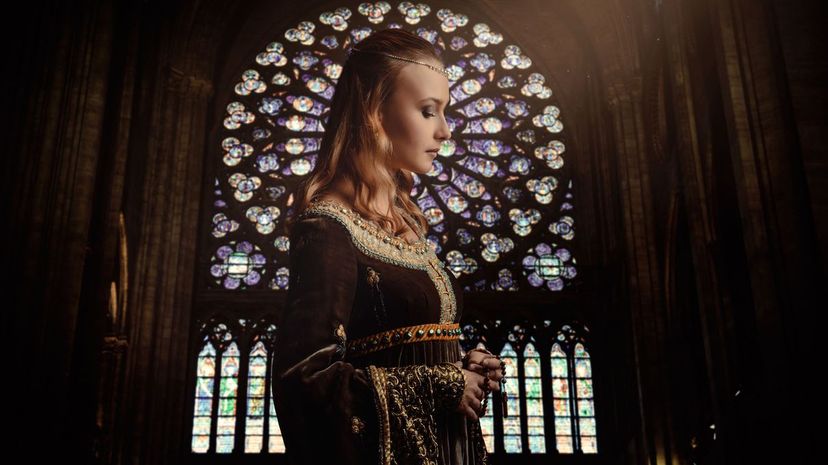 Woman wearing medieval dress in cathedral
