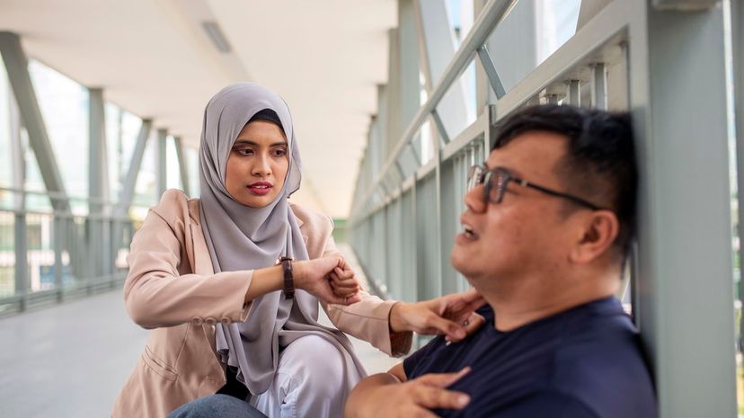 Woman helping man in crisis