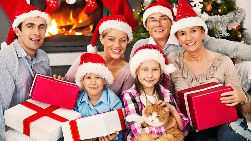 Large family with Santa's hats celebrating Christmas holiday