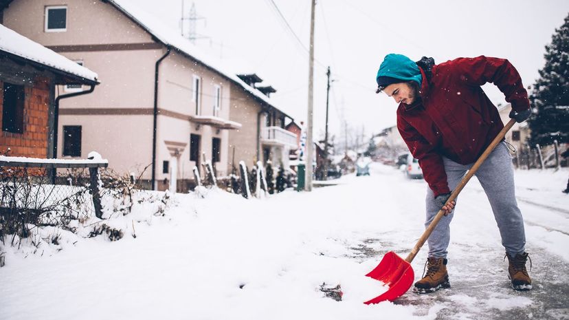 Man with snow shovel