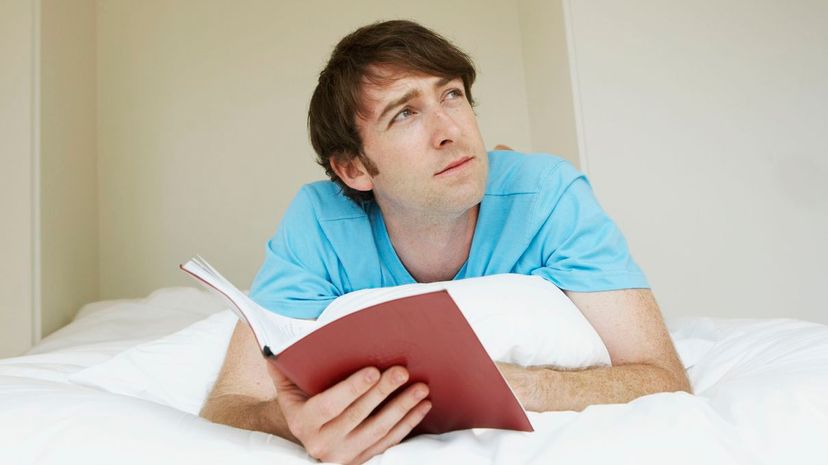 Man looking up on bed
