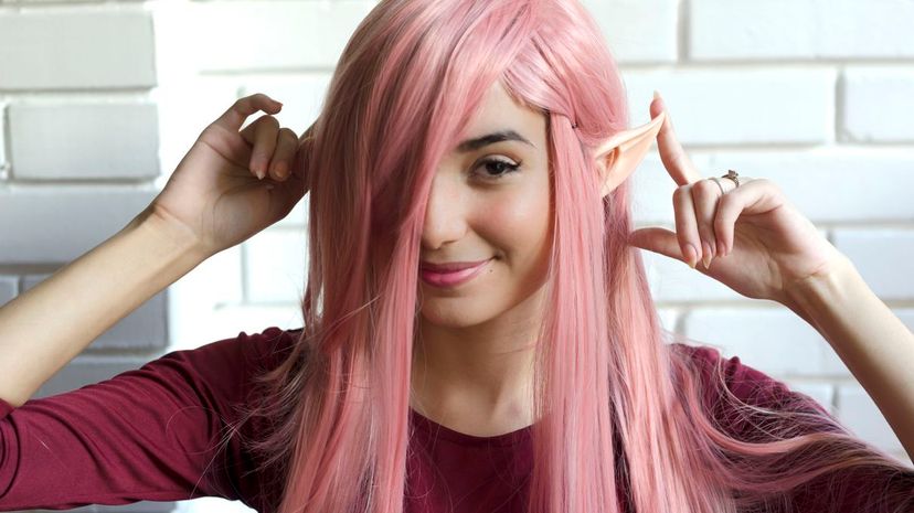 Beautiful young woman with pink hair and elf ears
