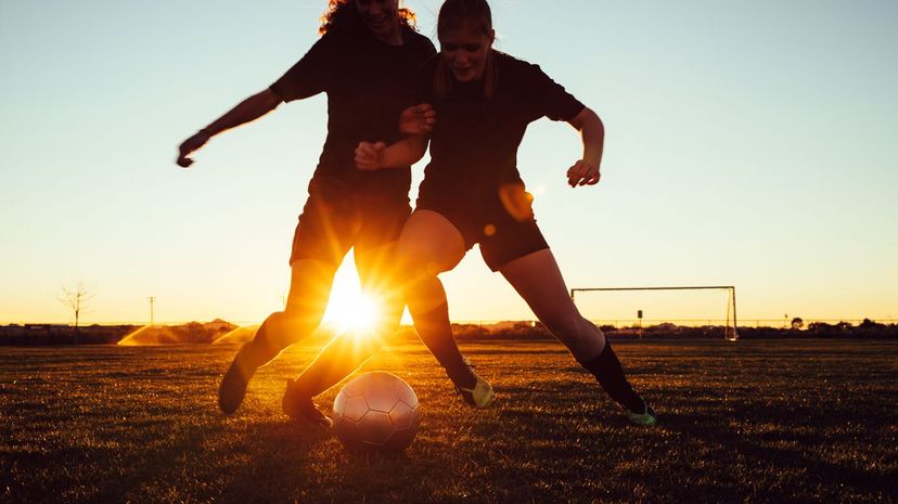 Female Soccer Players Battle for Ball