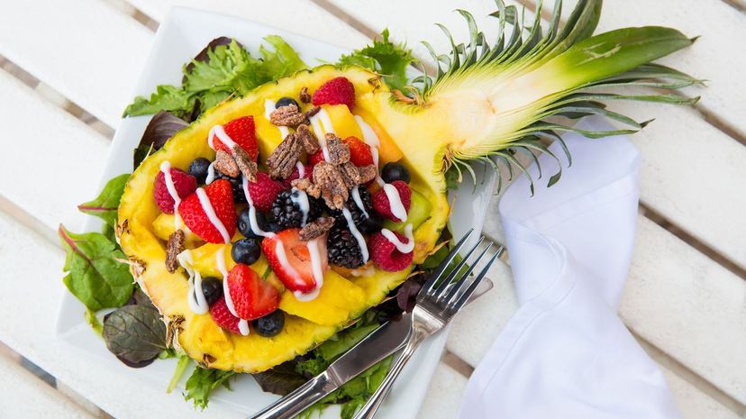 Fruit salad served in a half pineapple