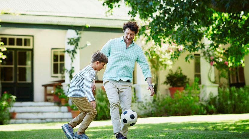 Dad and Son playing Soccer