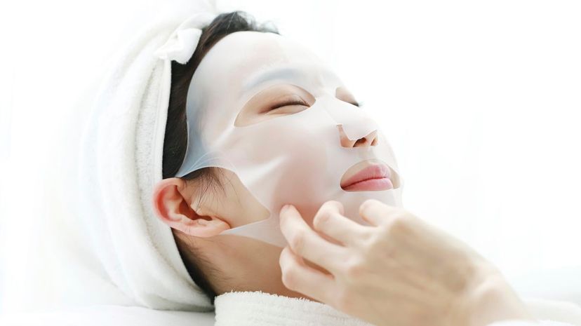 Woman using face mask