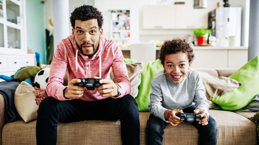 Father and son playing video game