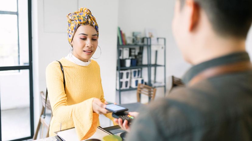 Young woman paying