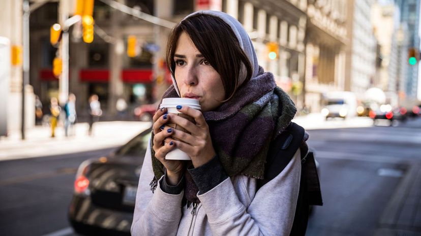 Young woman drinking coffee in downtown Toronto