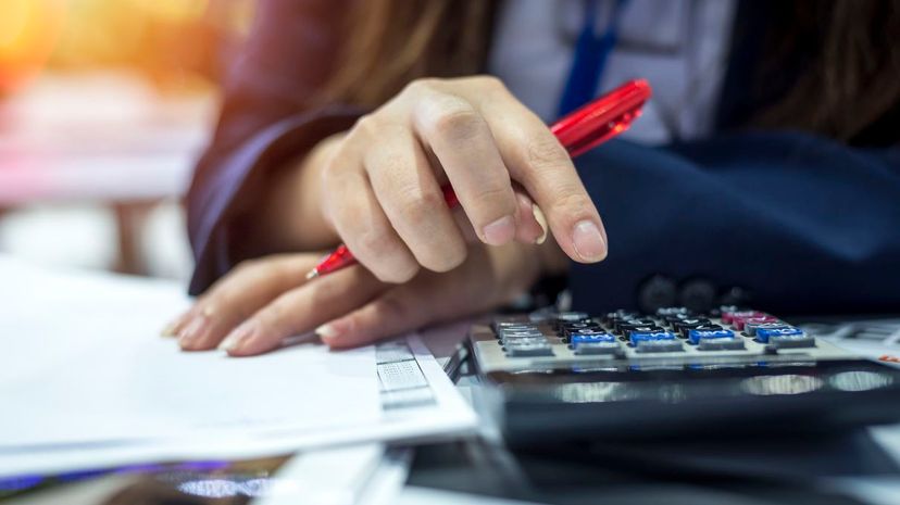 Woman using calculator