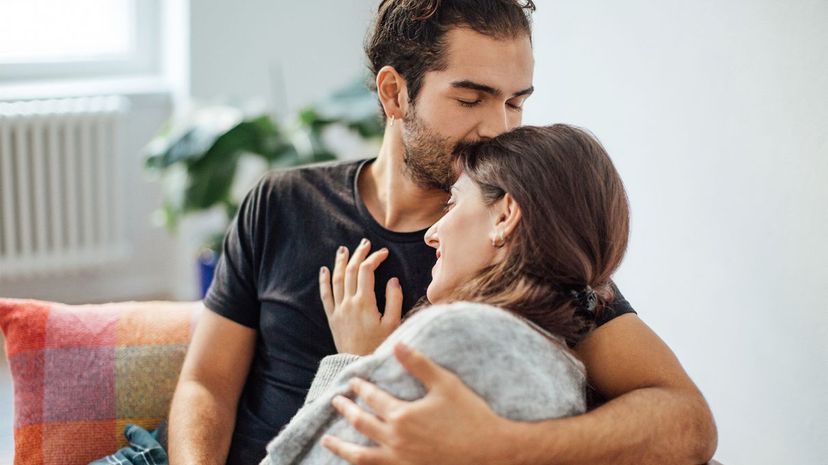 Man embracing girlfriend