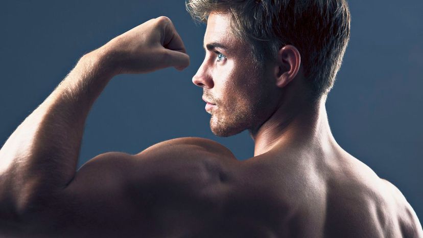 Man flexing biceps muscles