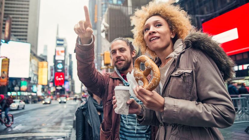 Couple visiting Times Square New York in autumn