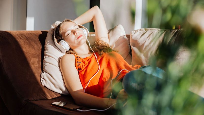 Woman relaxing and  listening to music