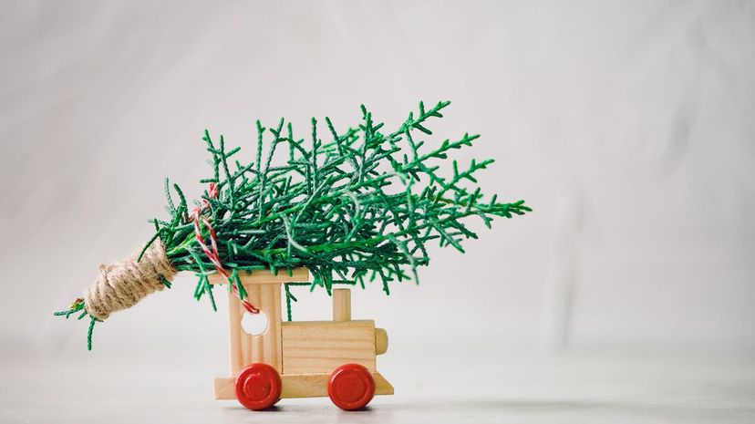 Q24-Christmas tree on the top of a wooden toy train