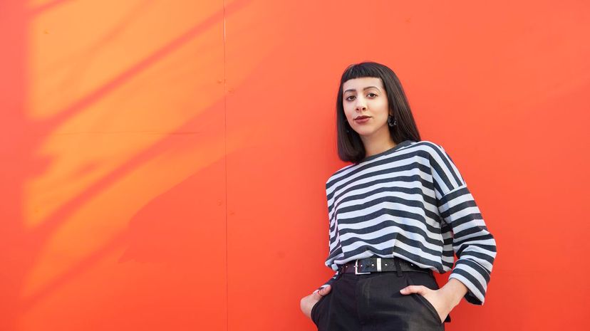 Young Woman, Red Wall