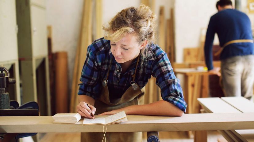 craftswoman making notes