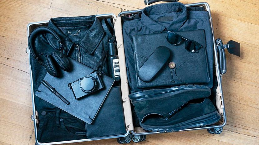 38 Suitcase with black clothes