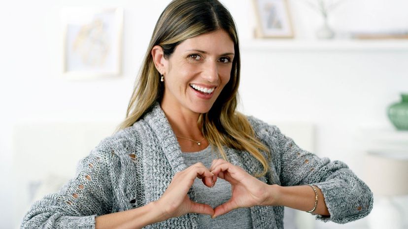 Woman forming a heart shape with her hands