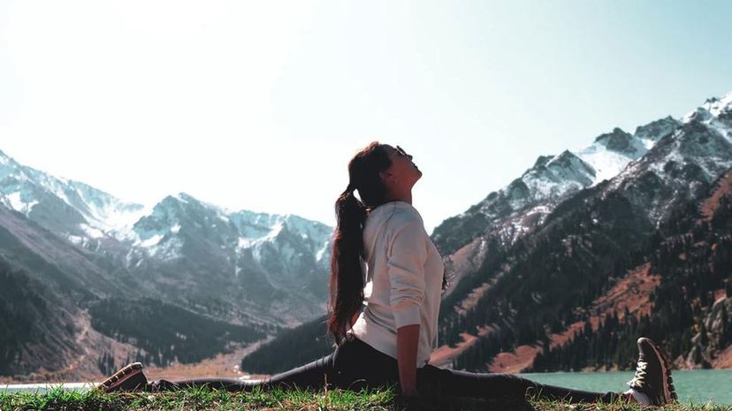 Woman stretch mountain