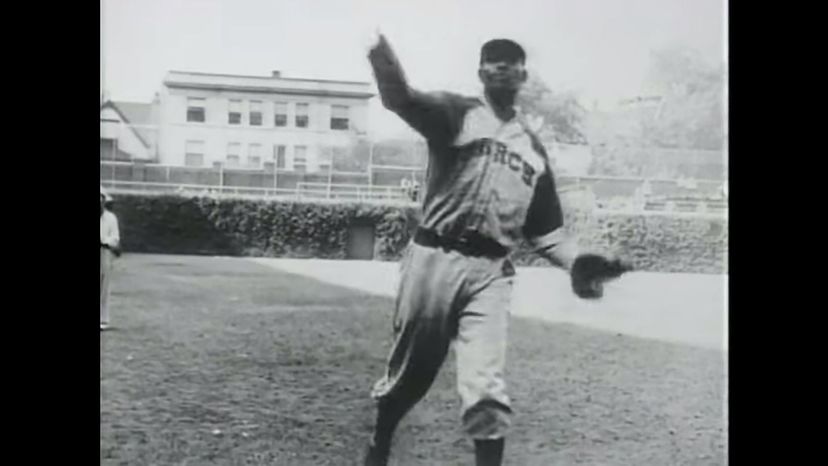 Satchel Paige becomes the first black pitcher (1948)