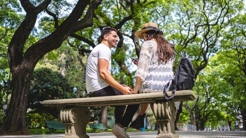 Couple talk at park