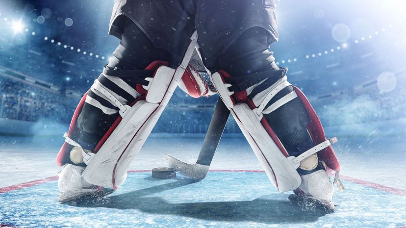 Close-up of an Ice Hockey puck hitting the back of the net