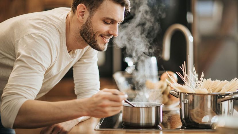 Man enjoying smell of his cooking