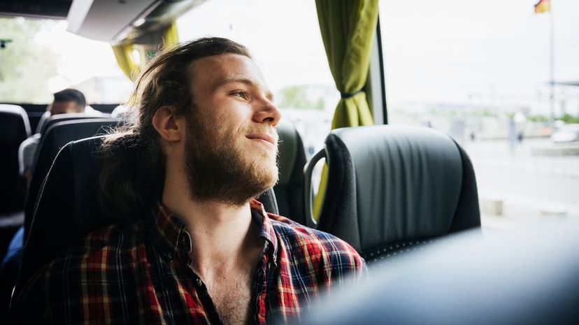 Young Man Relaxing During A Bus Trip