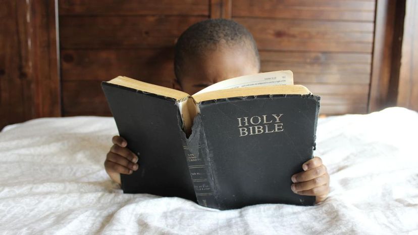 Kid reading bible
