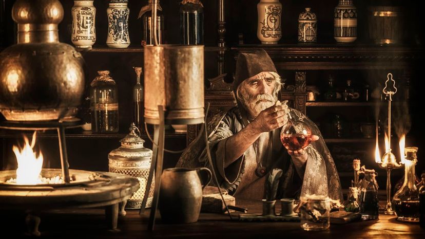 Medieval alchemist in his laboratory