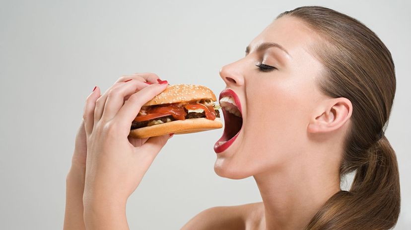 Girl eating hamburger