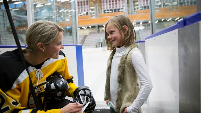 Female Ice Hockey Player and Fan