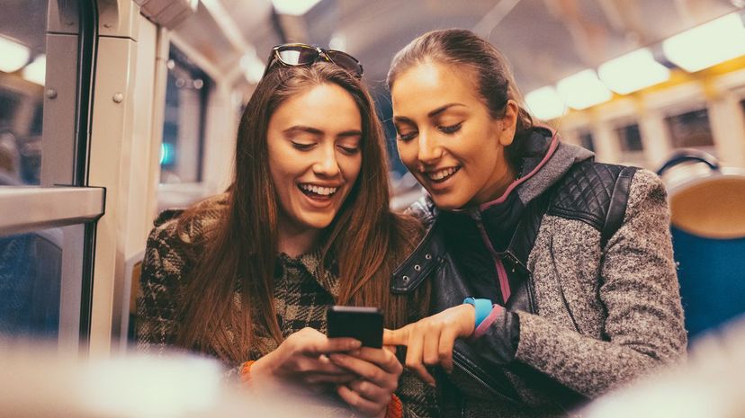 Two women looking at phone