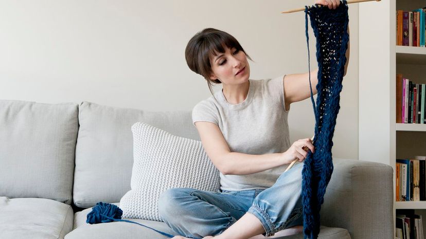 Woman examining knitting