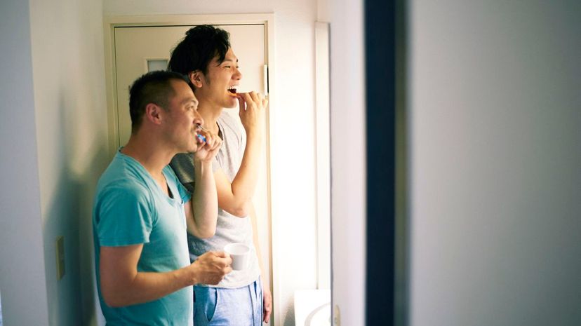 Couple brushing teeth