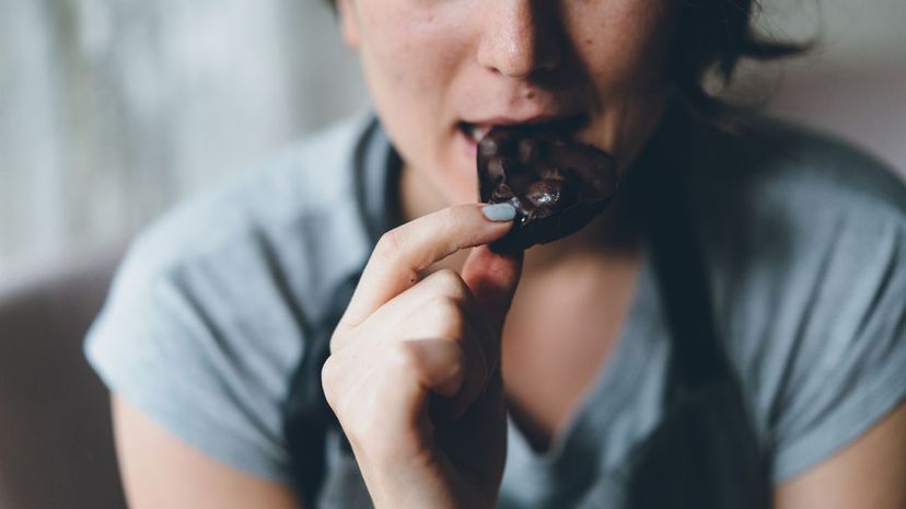 Woman eating chocolate
