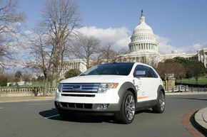 A Ford plug-in hybrid Edge cruises on Capitol Hill in Washington, on Jan. 17, 2007.