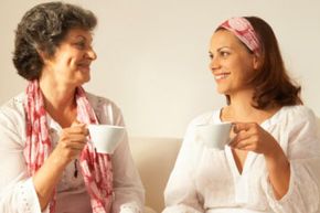 mother and daughter talking over coffee