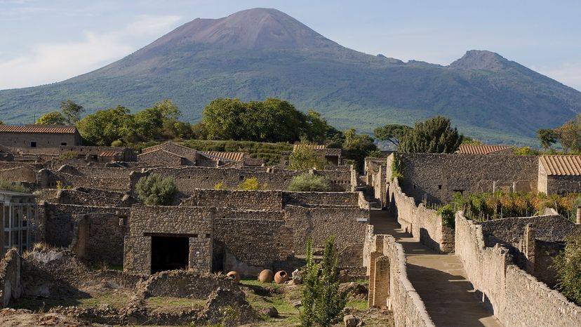 aerial view of Pompeii ruins with Mount Vesuvius in background