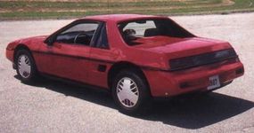 The Pontiac Fiero GT featured "flying buttress" rear roof                              supports and a slick fastback style.”border=